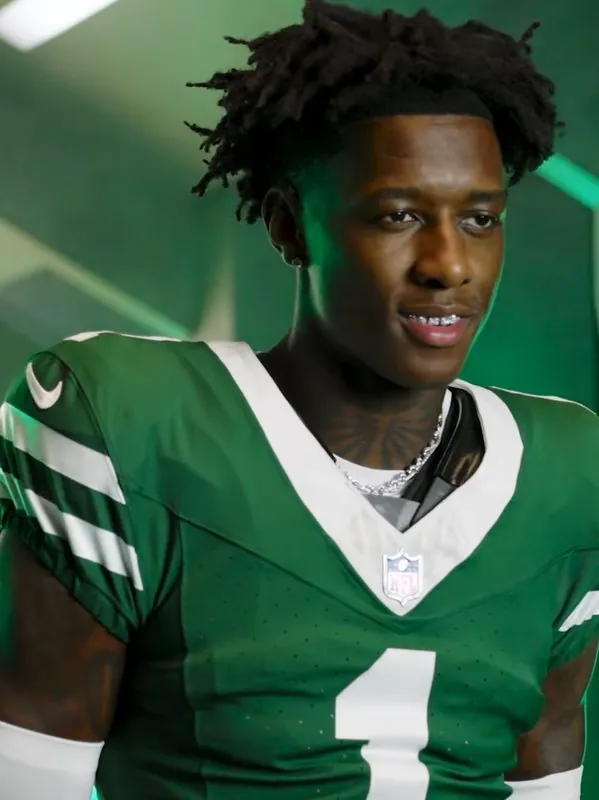 Sauce Gardner in a football uniform